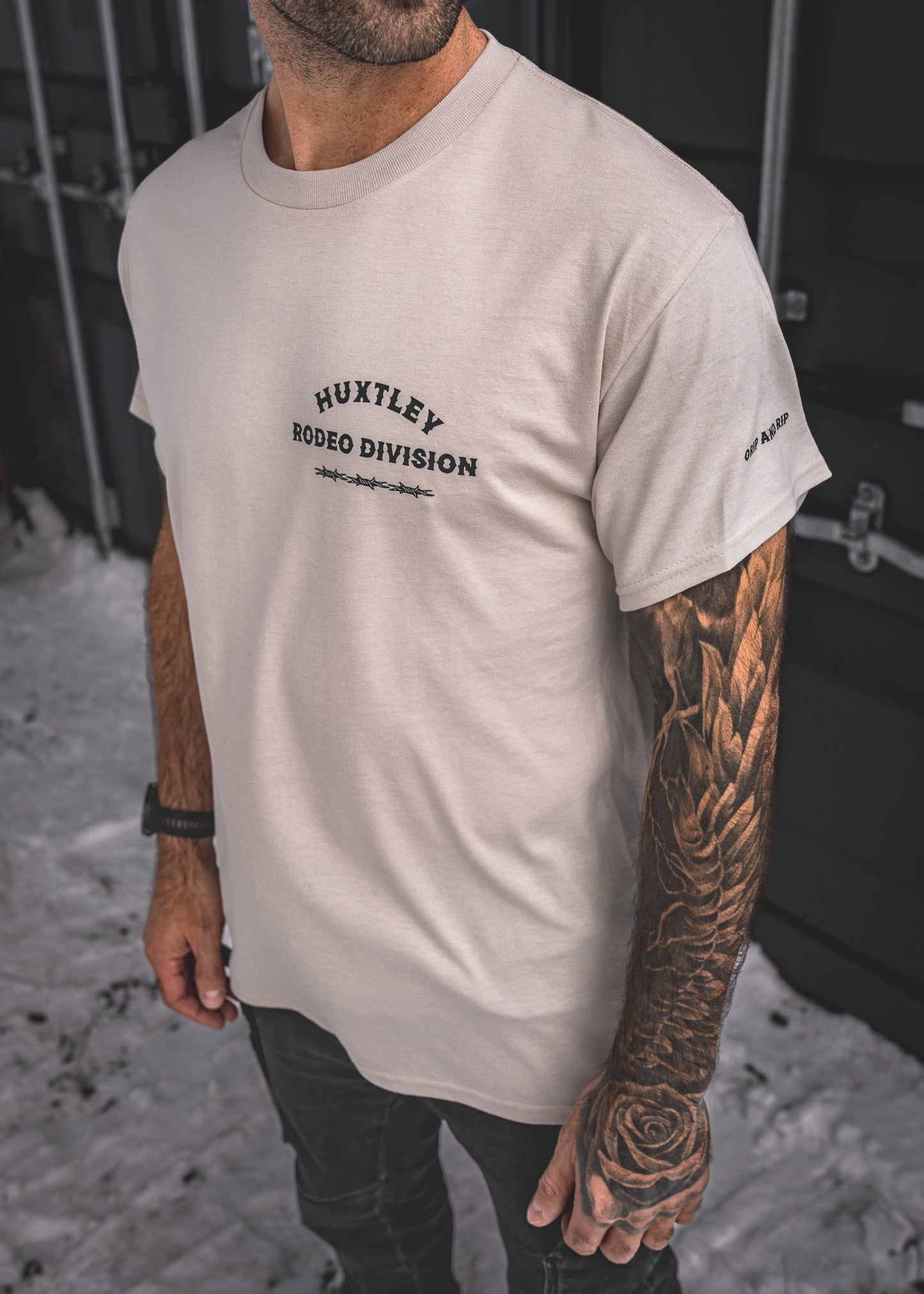 
                  
                    HX-891 "Rodeo Division" Tee Sand/ Black
                  
                