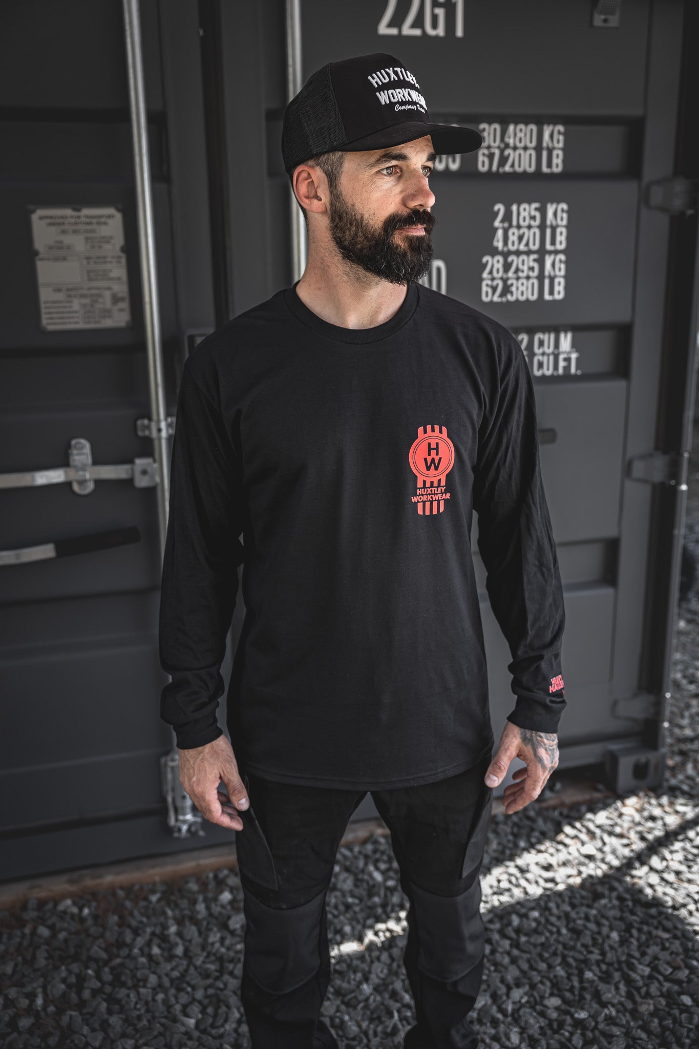 
                  
                    Front chest hit features the red “HW” piston emblem and “Heavy Haulers Club” sleeve detail. Long sleeve built for hard-driving haulers and jobsite lifers.
                  
                