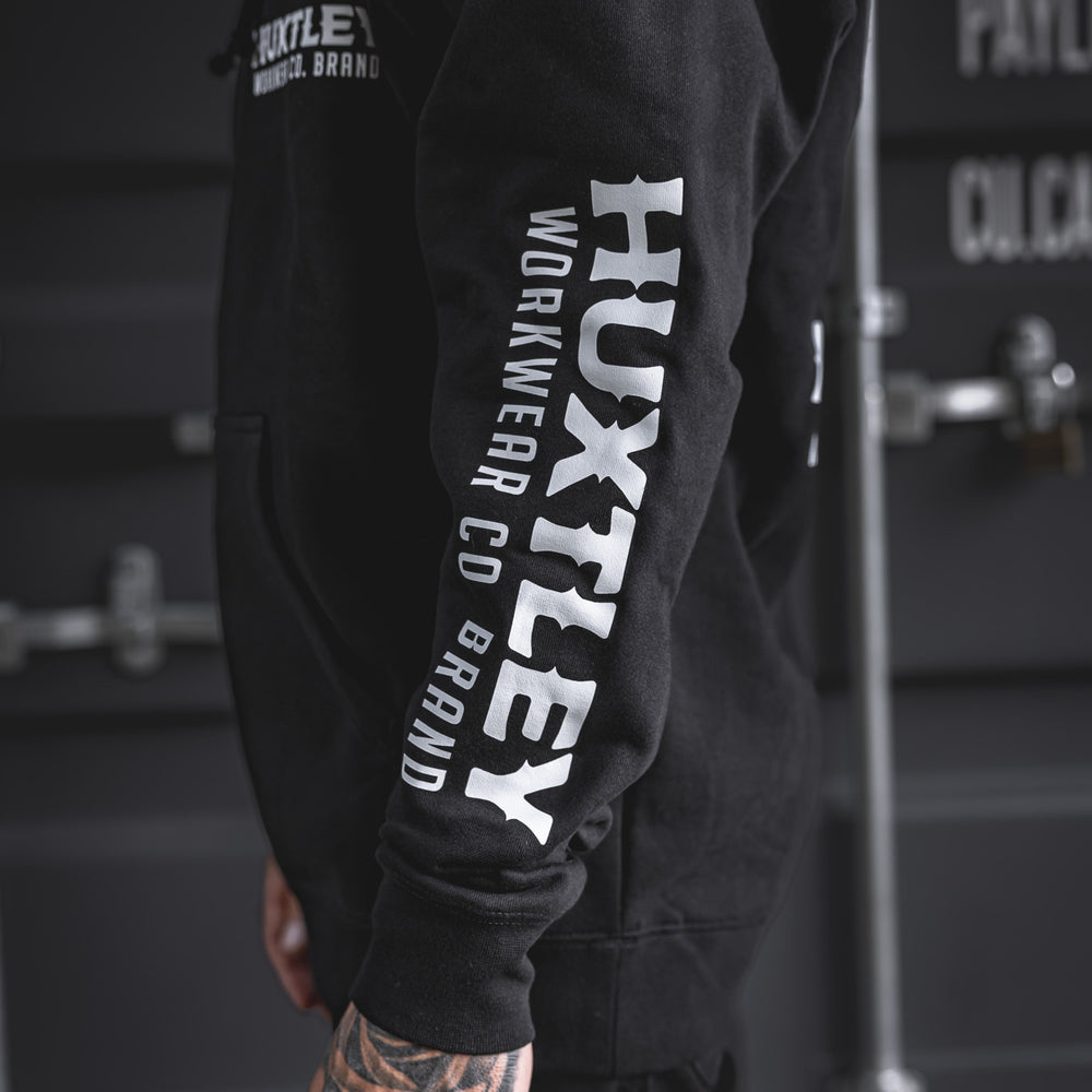 
                  
                    Close-up of the right arm on the Full Print Hoodie in white. Oversized HUXTLEY print down the sleeve keeps it loud and proud. Built for trades.
                  
                