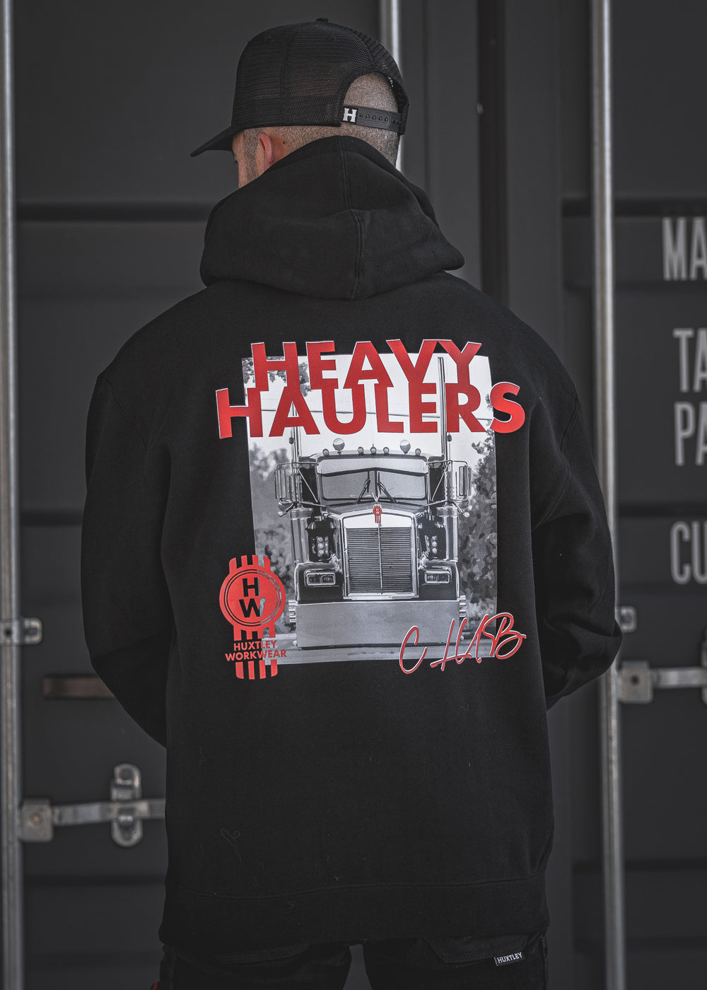 Roll heavy in the Huxtley Heavy Haulers Club Hoodie. This bold black hoodie features a full-back truck print and HW branding made for the road. Tough, warm, and built for the grind.