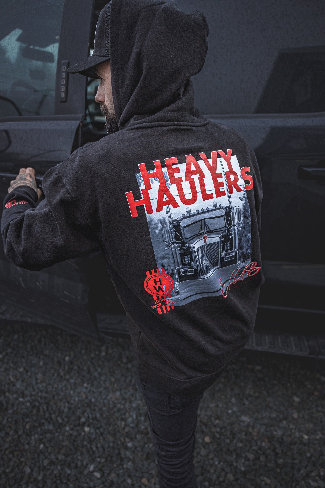 
                  
                    Rep the road in the Huxtley Heavy Haulers Club Hoodie. Featuring a bold red print and back graphic of a classic Kenworth rig, this hoodie is made for truckers, wrench-turners, and heavy haulers who don't stop for nothin'.
                  
                