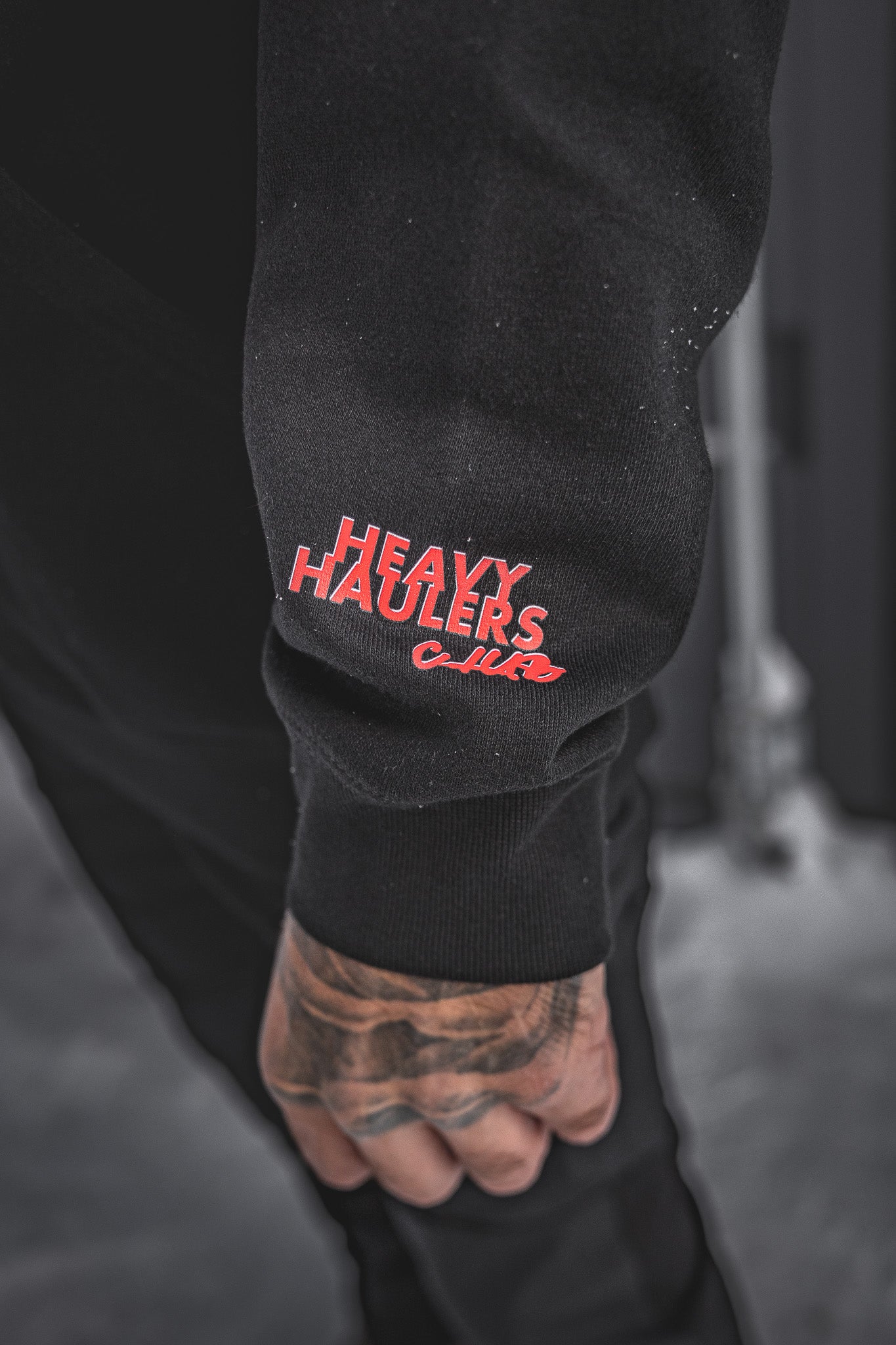 
                  
                    Join the crew with the Huxtley Heavy Haulers Club Hoodie. Built from heavyweight black fleece, it features bold chest and sleeve prints, plus a massive truck graphic on the back. This one's for the road dogs and rig riders.
                  
                