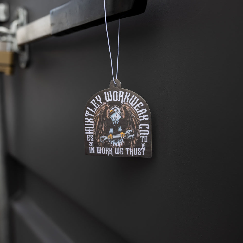 Huxtley’s eagle-emblazoned air freshener. A tough-as-nails scent built for trucks, toolboxes, and the blue-collar grind.