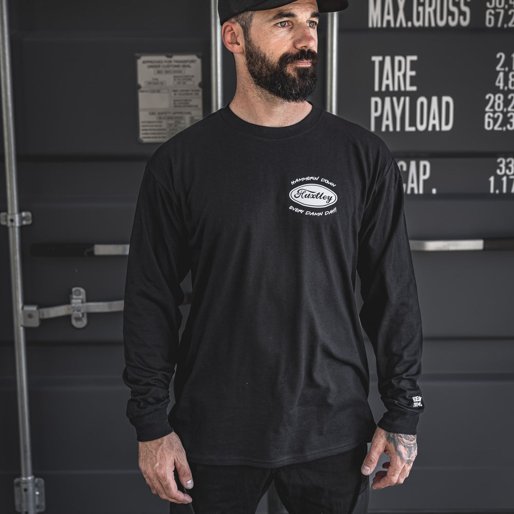 
                  
                    Full front shot of the black long sleeve featuring the oval “Huxtley” logo and “Hammerin’ Down Every Damn Day!!” chest hit. Sleeve detail reads “Keep On Trucking” for that classic big rig vibe.
                  
                