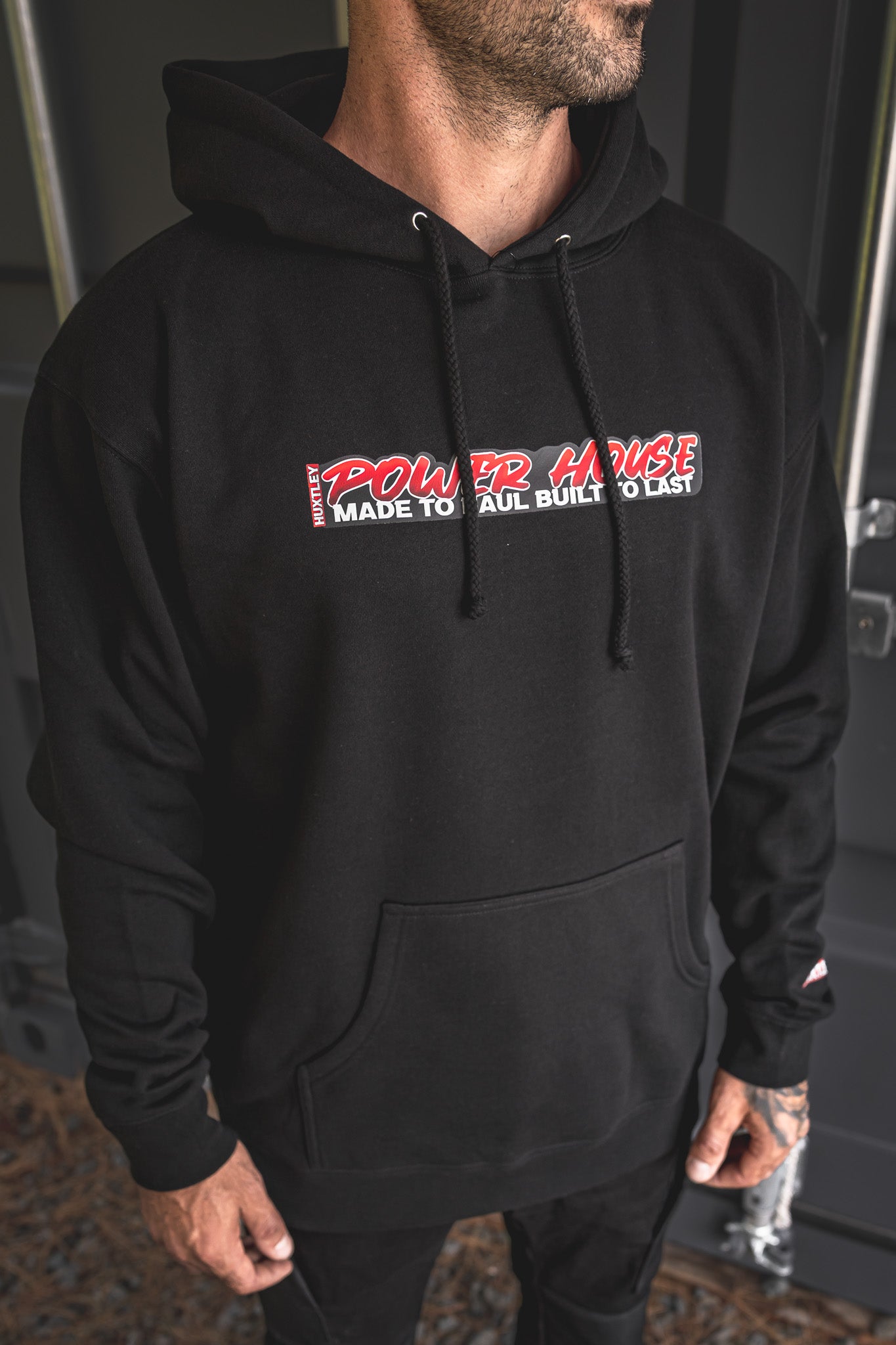 
                  
                    Heavyweight black hoodie with “POWER HOUSE – Made to Haul, Built to Last” front graphic and Huxtley branding. Tough, comfortable, and ready for daily grind.
                  
                