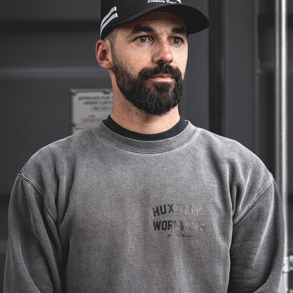 
                  
                    The Throwback cap brings vintage athletic stripes and bold Huxtley embroidery together. Worn here by a rugged model in a washed crewneck, this look hits hard on and off the clock.
                  
                