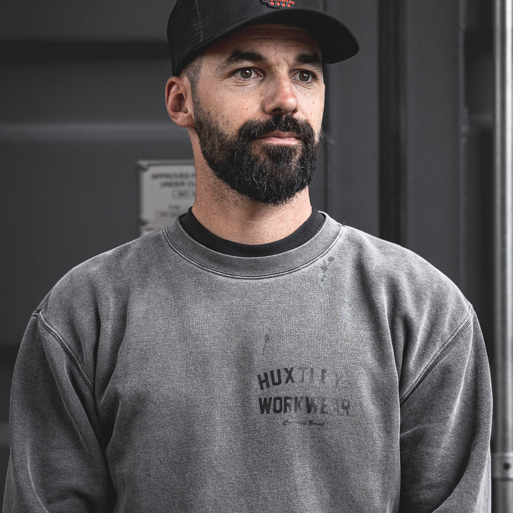 
                  
                    Bold and built for the grind. This Huxtley trucker cap features the standout red badge logo, breathable mesh panels, and a perfect fit for everyday jobsite wear.
                  
                