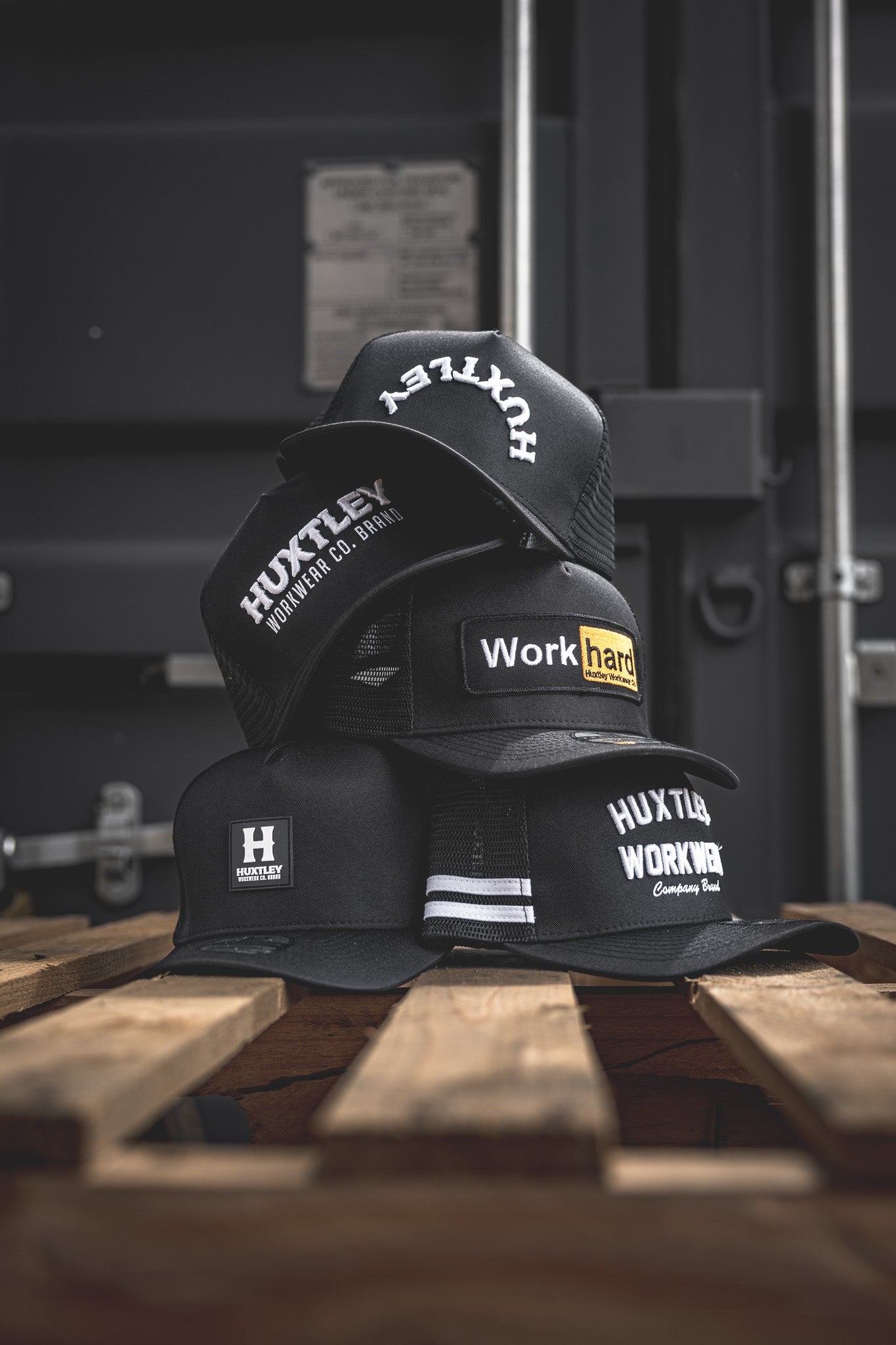
                  
                    All the classics in one shot: from “Work Hard” to “Huxtley Co. Brand,” this lineup of black truckers is built for grit, graft, and good times. Stack your favourites.
                  
                