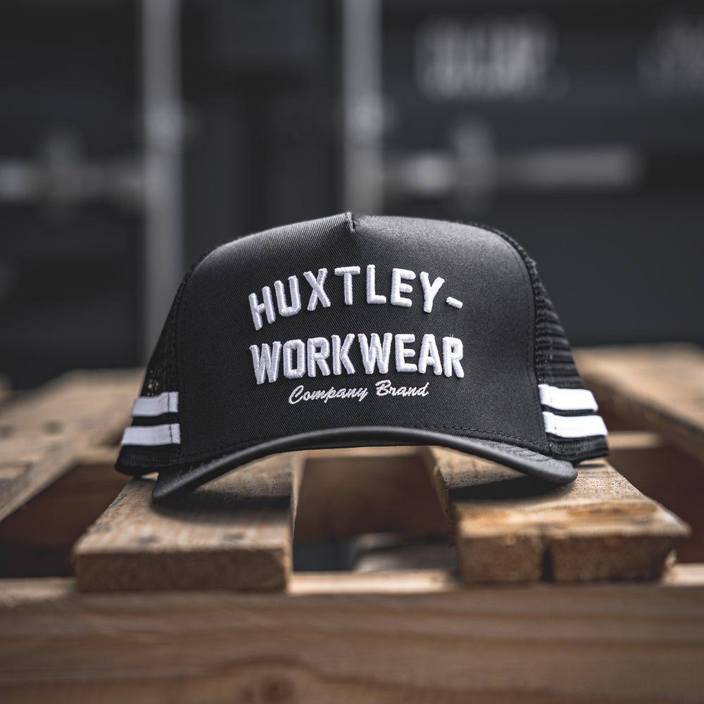 
                  
                    Level up your fit with the Throwback cap from Huxtley Workwear. Featuring bold arch text, contrast double stripes, and vintage shop-floor vibes. A classic built for modern grit.
                  
                